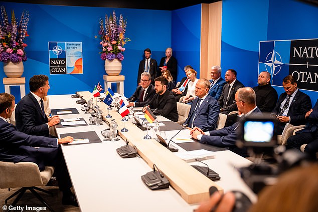 Emmanuel Macron, France's president, Mark Rutte, secretary general of the North Atlantic Treaty Organization (NATO), Giorgia Meloni, Italy's prime minister, Keir Starmer, UK prime minister, Volodymyr Zelenskiy, Ukraine's president, Donald Tusk, Poland's prime minister, and Friedrich Merz, Germany's chancellor, during a meeting at the NATO summit
