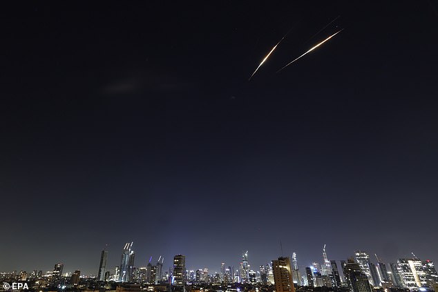 Iranian ballistic missiles seen over the sky, in Tel Aviv, Israel, 18 June 2025