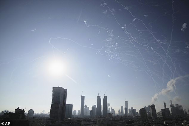 Israeli air defense system fires to intercept missiles during an Iranian attack over Tel Aviv, Israel, Thursday, June 19, 2025