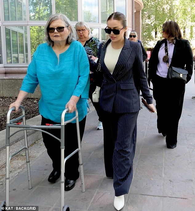 Erik's stepdaughter Talia (right) has supported him in court along with other family members