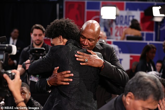 Harper hugs his father, five-time NBA Champion Ron, after the Spurs picked him at No 2