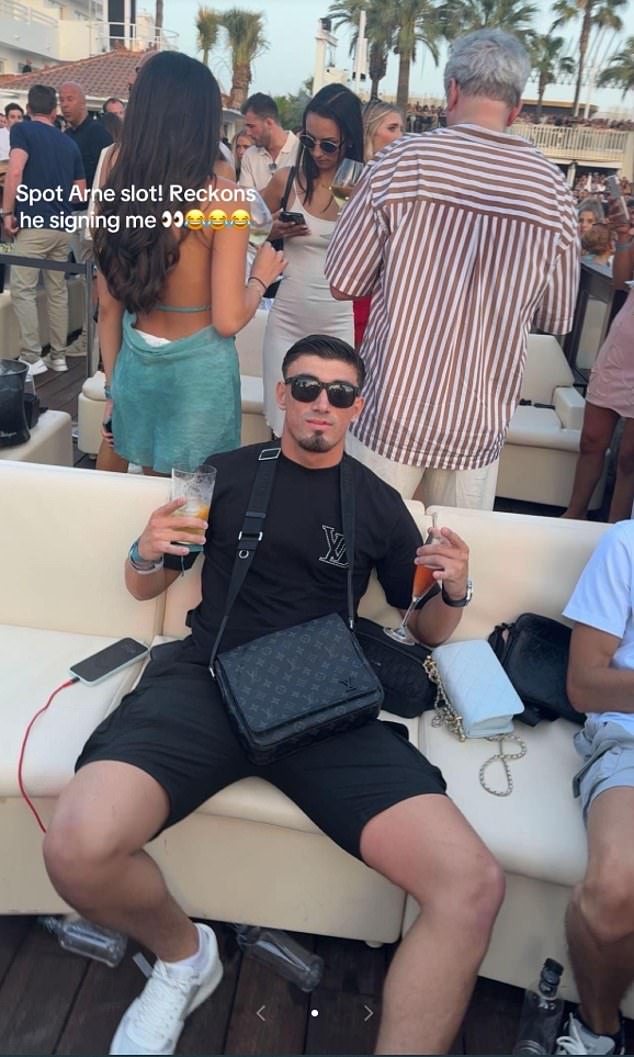 Harratt pictured on an Ibiza trip, claiming Liverpool's title-winning boss Arne Slot was behind him