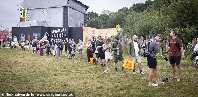Long queues for the showers at Glastonbury Festival at Worthy Farm in Somerset this morning