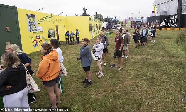 Long queues for the showers at Glastonbury Festival at Worthy Farm in Somerset this morning
