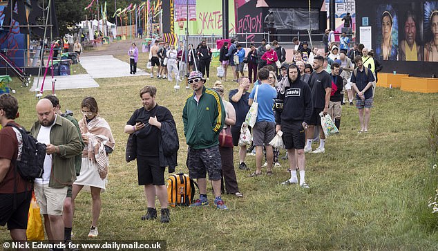 Long queues for the showers at Glastonbury Festival at Worthy Farm in Somerset this morning