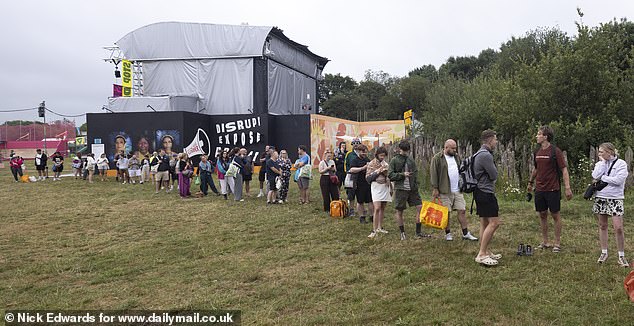 Long queues for the showers at Glastonbury Festival at Worthy Farm in Somerset this morning