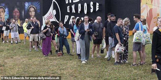 Long queues for the showers at Glastonbury Festival at Worthy Farm in Somerset this morning