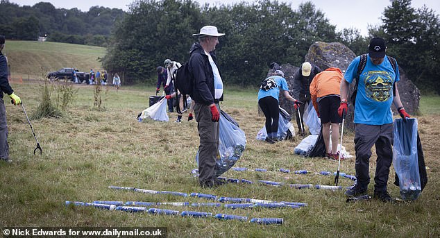 A litter clean-up at the Stone Circle area of the Glastonbury site at Worthy Farm this morning