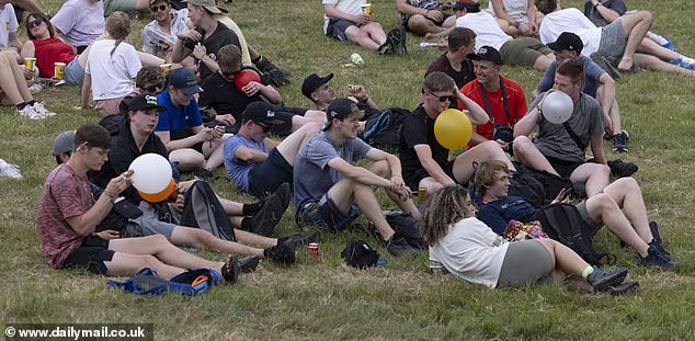People with balloons in their mouths at Glastonbury Festival in Somerset yesterday evening