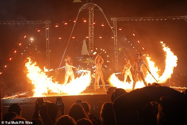 Circus performers take part in the opening ceremony at Worthy Farm in Somerset last night