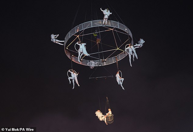 Acrobats take part in the opening ceremony during the Glastonbury Festival at Worthy Farm