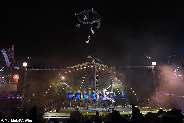 Acrobats take part in the opening ceremony during the Glastonbury Festival at Worthy Farm