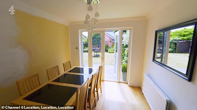 Though the property was double the size of their previous home, Charlene and Jay said it was 'too small'. Pictured: The dining area in the first property with a view of the garden
