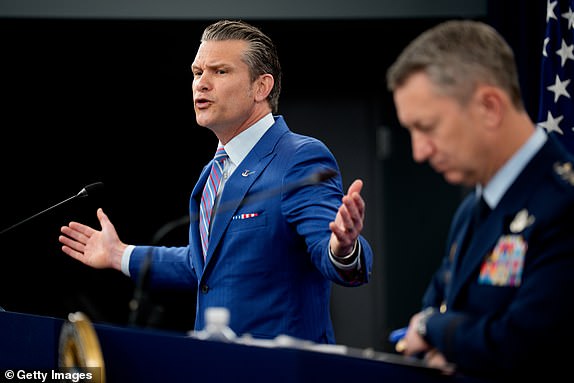 ARLINGTON, VIRGINIA - JUNE 26: U.S. Defense Secretary Pete Hegseth (L) accompanied by Chairman of the Joint Chiefs of Staff Air Force Gen. Dan Caine (R), speaks during a news conference at the Pentagon on June 26, 2025 in Arlington, Virginia. Top officials from the Department of Defense gave an update after three Iranian nuclear facilities were struck by the U.S. military last weekend and Iran countered by launching missiles at Al Udeid Air Base in Qatar. (Photo by Andrew Harnik/Getty Images)