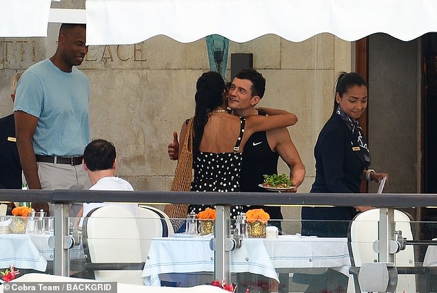 Orlando was later seen sharing a hug with entrepreneur Elsa Marie Collins, who is one of Lauren's closest friends, as they dined al fresco