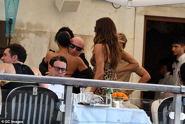 Kim was later seen greeting another friend as the group mingled with each other