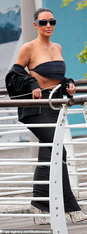 The mother-of-four was dressed to impress as she sashayed along the dock and jumped into a river taxi