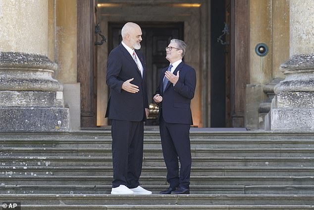 Prime Minister of Albania Edi Rama, left, is welcomed by Prime Minister Sir Keir Starmer, right, to the European Political Community summit at Blenheim Palace in Woodstock, Oxfordshire, England, Thursday, July 18, 2024