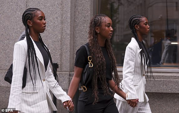 epa12198802 (L-R) D'Lila Combs, Chance Combs and Jessie Combs, the children of US rapper and record executive Sean 'Diddy' Combs, enter a federal courthouse as Sean Combs' trial for sex trafficking, racketeering, and prostitution charges is set to begin closing arguments in New York, New York, USA, 26 June 2025.  EPA/SARAH YENESEL