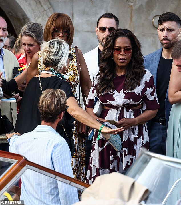 Gayle King and Oprah Winfrey were also there. Gayle was seen in a white and yellow dress while Oprah flaunted her figure in a maroon number that had cut-outs on the midriff area