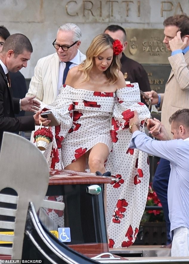 Tommy Hilfiger opted for a striped, white dress while his wife Dee Ocleppo had on a tiny polka-dotted gown with enormous sleeves