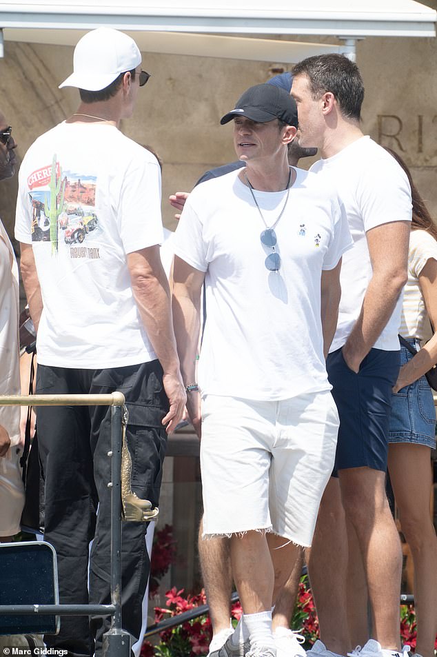 Tom Brady (left), and Orlando (right) were also joined by a wider group of friends amid claims of the latter's 'split' from partner Katy Perry, with whom he shares daughter Daisy Dove