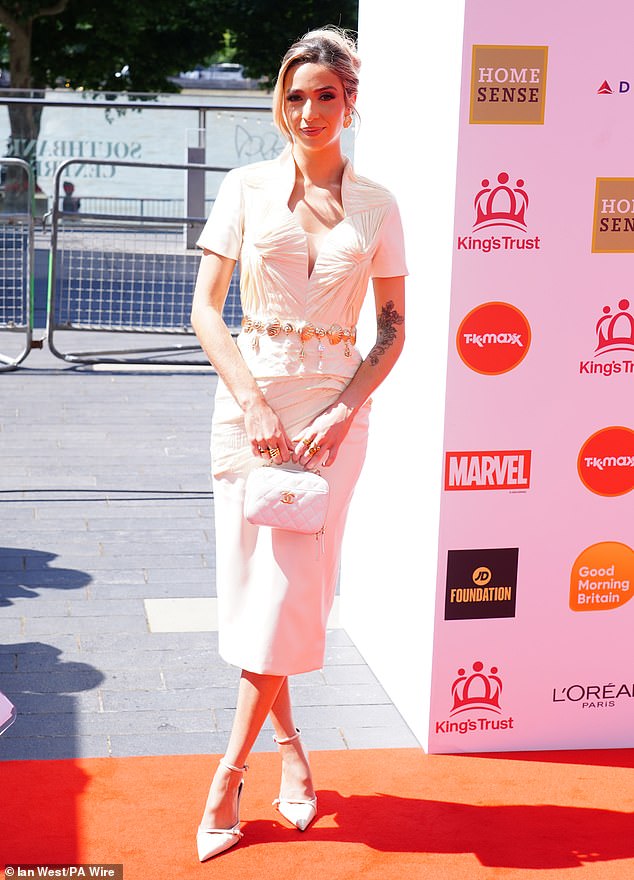 I'm A Celebrity star GK Barry turned heads in a white midi dress
