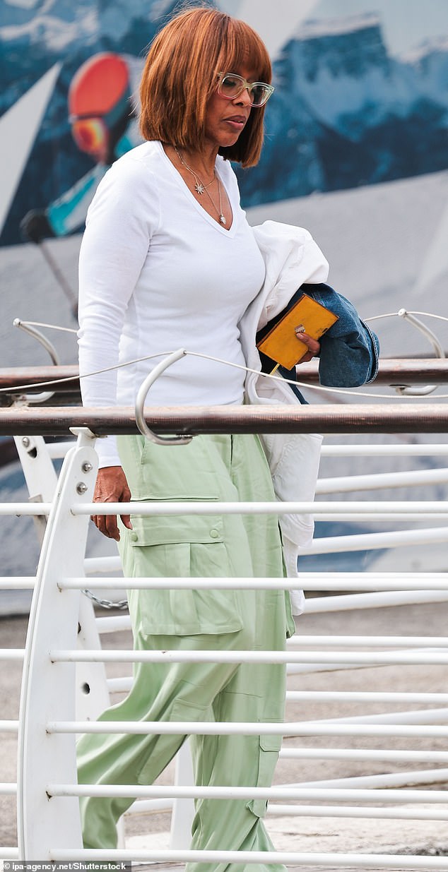 The bride-to-be's fellow Blue Origin astronaut Gayle King arrived to Venice on Wednesday wearing a pair of ill-fitting, oversized light green cargo pants and a white v-neck tee shirt. She clutched a denim jacket in one hand and kept things casual in a pair of translucent eye glasses