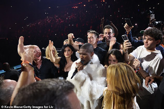 The Amazon founder, 61, and the former journalist, 55, seem to be huge fans of Usher's, as they were spotted dancing front row at one of his concerts back in December
