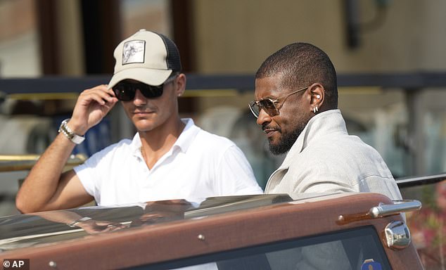 The musician donned a gray sweater, white trousers, and dark sunglasses for the occasion