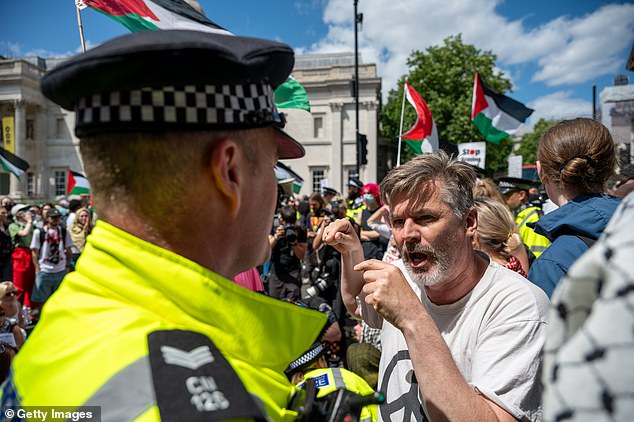 Members of the Metropolitan Police encourage Pro-Palestine supporters to leave Trafalgar Square on June 23, 2025 in London, England