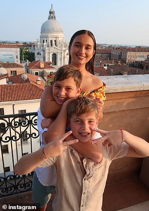 The siblings posed in front of one of the historic sights