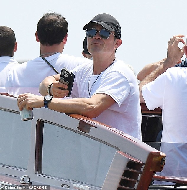 Even while enjoying a boat ride through the majestic city, Orlando looked somewhat somber