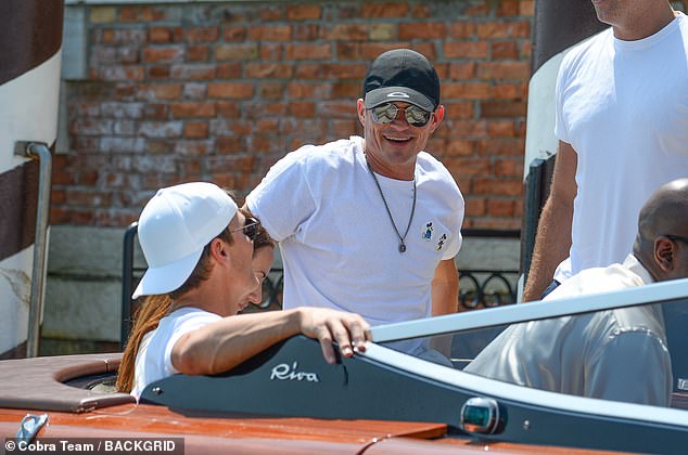 He spirits were lifted as he joined Tom Brady in a boat