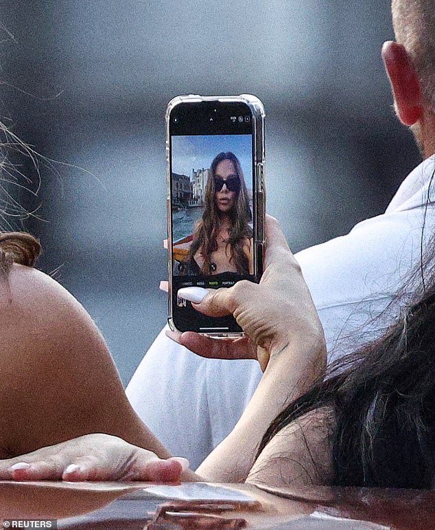 She struck a few poses as the sun set in the distance as Khloe snapped some photos - but a hilarious detail quickly emerged to reveal that the Good American founder had been taking selfies of herself rather than of Kim