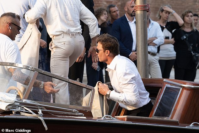 Former husband of Gisele Bundchen, Tom, donned a white dress shirt with the top few buttons undone
