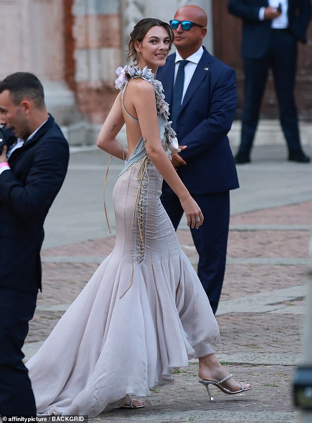 Gathering her hair back into an elegant updo, the Brescia-born fashionista sharpened her features with makeup that brought out her luminous complexion