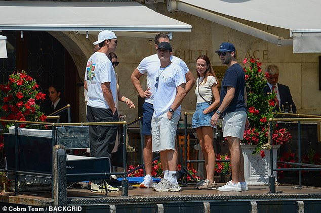 Brady (white hat) was with Orlando Bloom, Alex Spiro, as well as a mystery man and woman