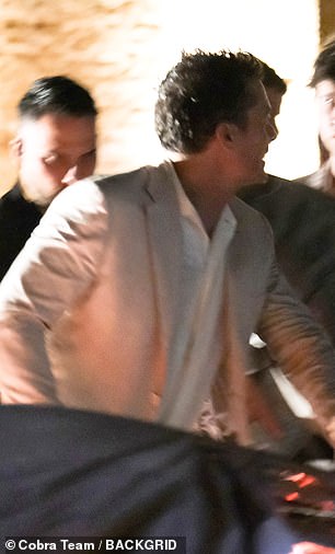 He chatted with security and other guests before boarding his water taxi