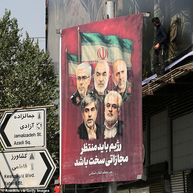 Posters featuring images of Iranian nuclear scientists Mohammad Mehdi Tehranchi and Fereydoun Abbasi-Davani, who were killed in Israeli attacks, as well as senior Islamic Revolutionary Guard Corps (IRGC) commanders Major General Hossein Salami, Major General Gholamali Rashid, Aerospace Force Commander Amir Ali Hajizadeh, and Major General Mohammad Bagheri, are put up on the streets of Tehran