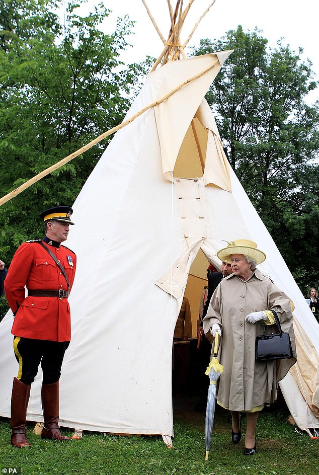 Despite being greeted by light showers, Queen Elizabeth remained characteristically composed and elegant, wearing a classic trench coat, wide-brimmed hat and transparent umbrella, trimmed in the same cheerful yellow as the jacket she would later reveal