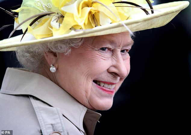 The weather did little to dampen the Queen's spirits - her face lit with a radiant smile that reflected her genuine delight at being in Canada
