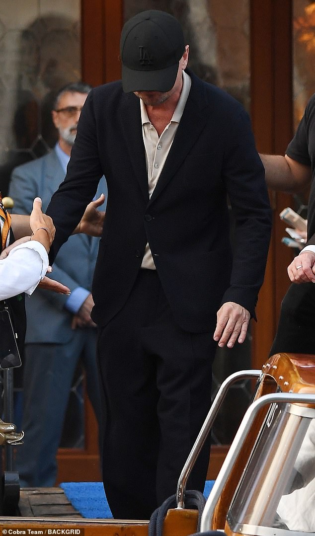 Guests were seen stepping onto boats as they left their hotel to head to a party one day before the main wedding ceremony; Leonardo DiCaprio seen above