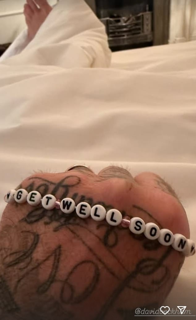 A second photo showed David with a bracelet which read: 'Get well soon'