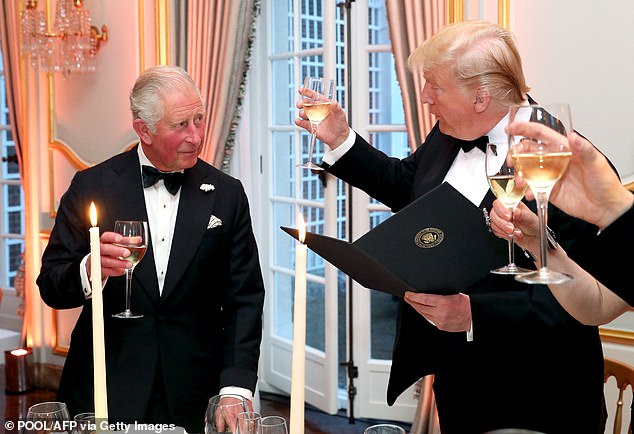 The US President raises a glass to then Prince Charles at Winfield House, the US Ambassador's residence in London