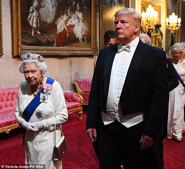 Trump walks to the State Banquet with Queen Elizabeth II in 2019