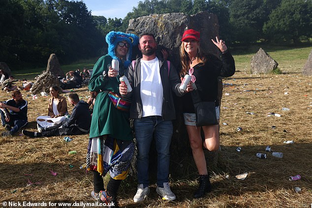 Glastonbury festivalgoers enjoy the sunshine this morning at Worthy Farm in Somerset
