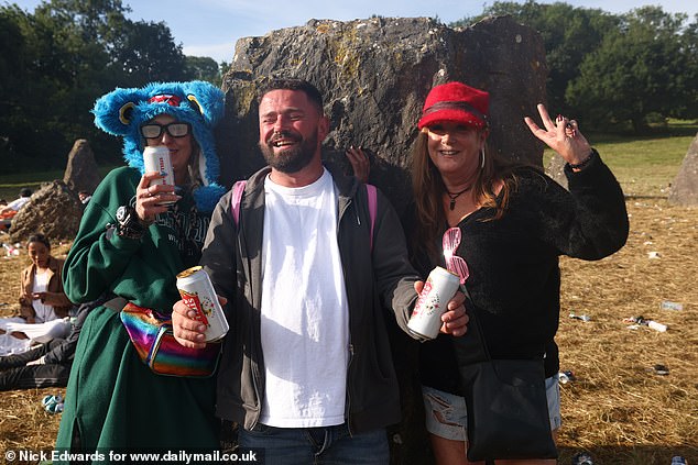 Glastonbury festivalgoers enjoy the sunshine this morning at Worthy Farm in Somerset