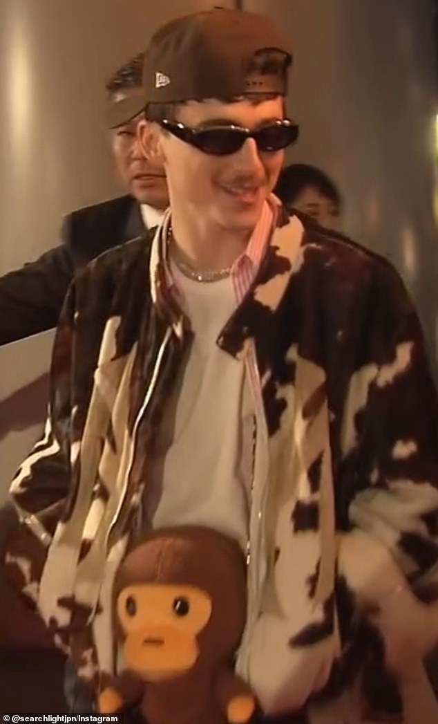 Timothee had a BAPE monkey bag around his neck at the Tokyo premiere for A Complete Unknown
