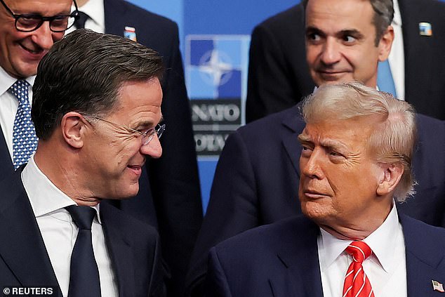 US President Donald Trump and NATO Secretary General Mark Rutte look at each other ahead of a family photo during a NATO leaders summit in The Hague, Netherlands June 25, 2025